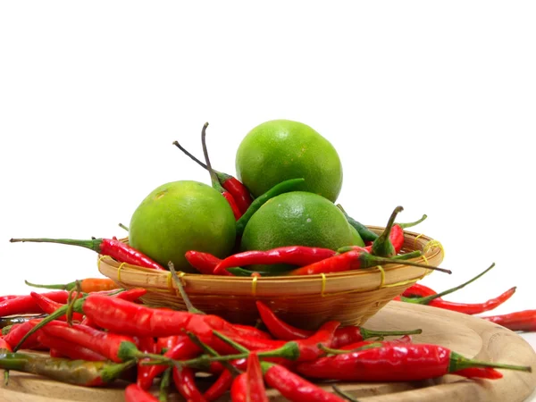 Lima e pimentas vermelhas isoladas em branco — Fotografia de Stock