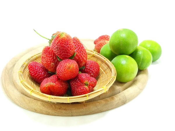 Strawberries with lime closeup over white background — Stock Photo, Image