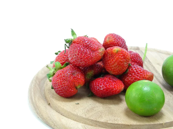 Strawberries with lime closeup over white background — Stock Photo, Image