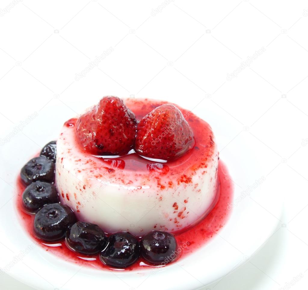 Milk pudding dessert with strawberry and blue berry