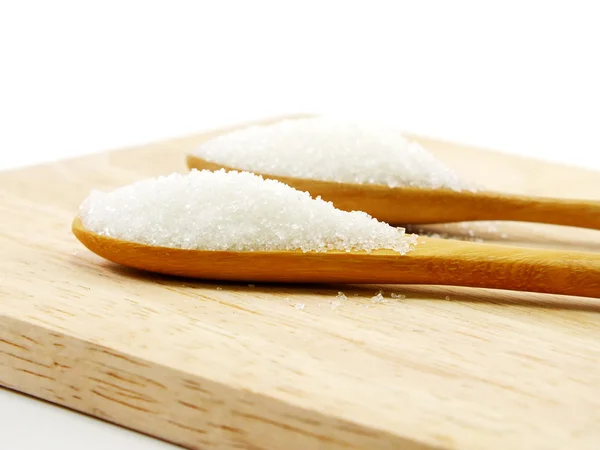 Suiker in een houten lepel selectieve aandacht — Stockfoto