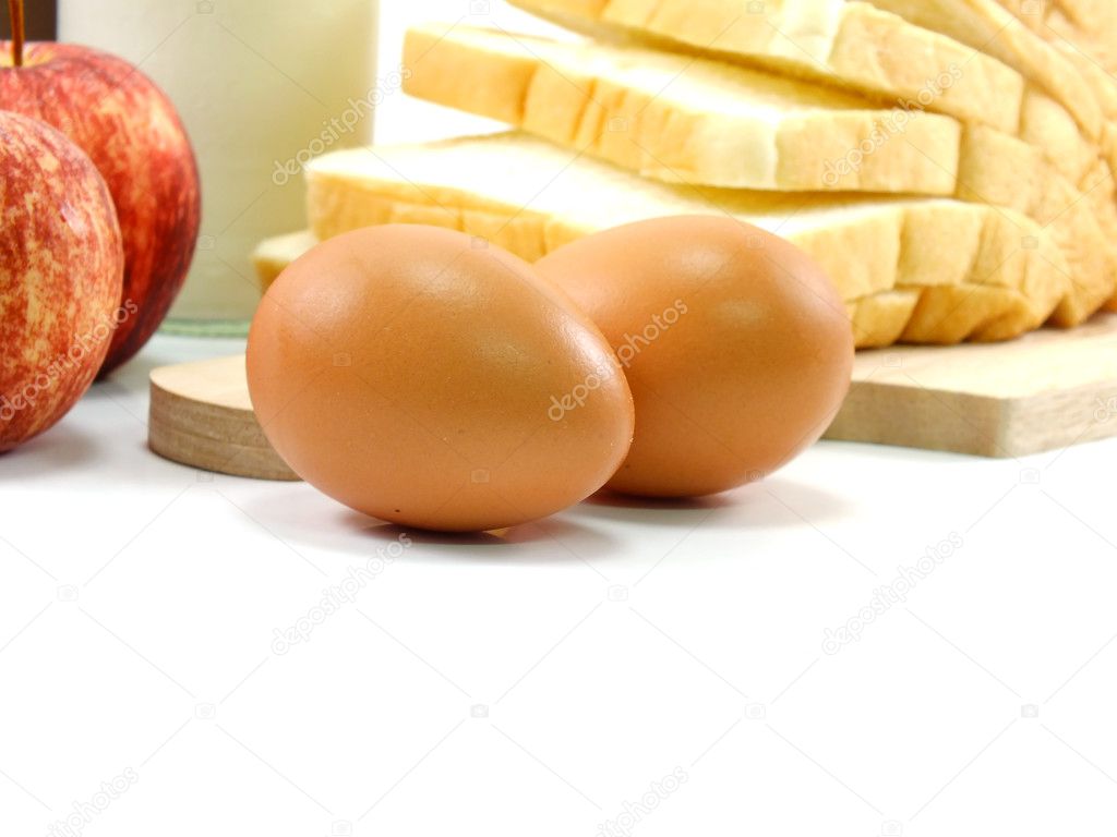 eggs and slice bread on white background