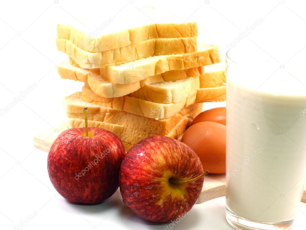 Red apples and slice bread with milk for breakfast in morning