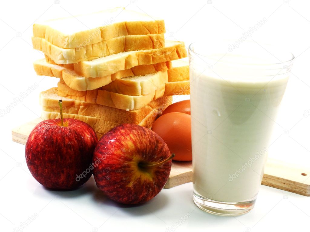 Red apples and slice bread with milk for breakfast in morning