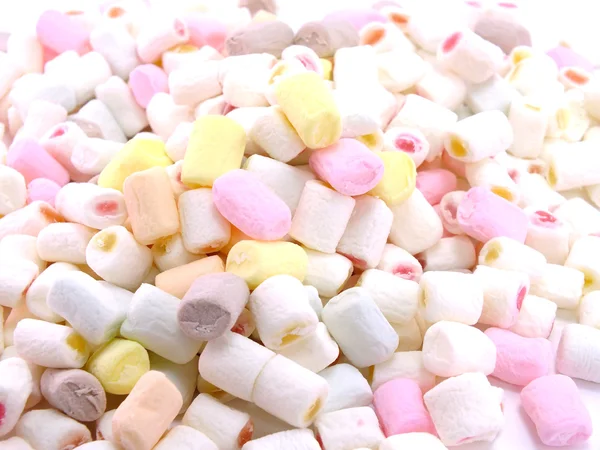 Bonbóny marshmallows barevné pozadí — Stock fotografie