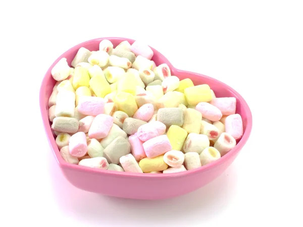 Massor av små marshmallows på vit bakgrund — Stockfoto