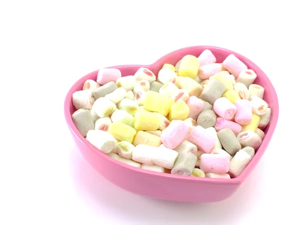 Un sacco di piccoli marshmallow su sfondo bianco — Foto Stock