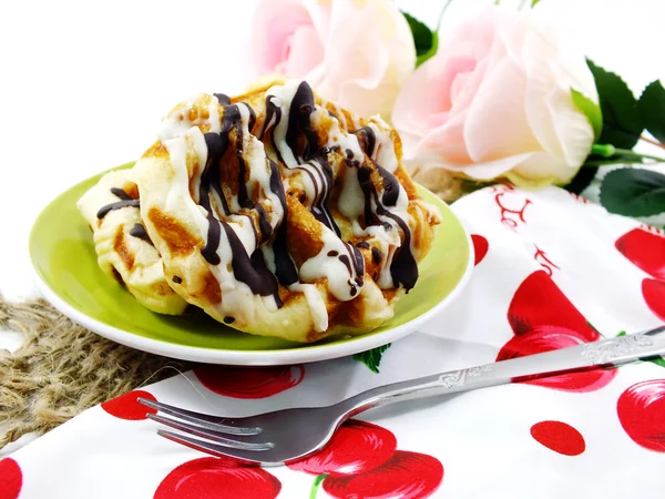 Freshly sweet waffles on a tablecloth background — Stock Photo, Image