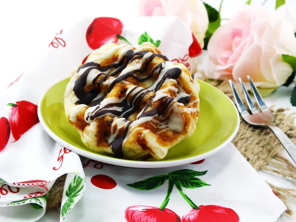 Freshly sweet waffles on a tablecloth background — Stock Photo, Image