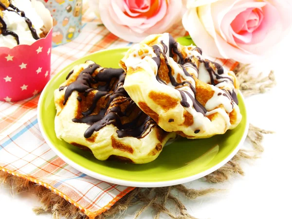 Freshly sweet waffles on a tablecloth background — Stock Photo, Image