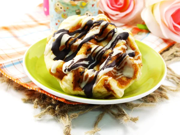 Freshly sweet waffles on a tablecloth background — Stock Photo, Image