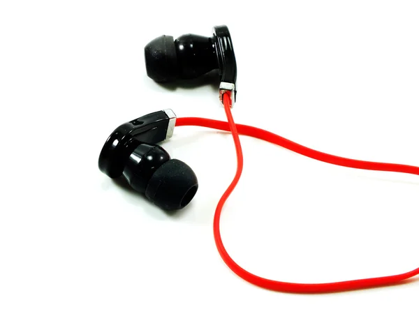 Zwarte en rode oortelefoons op witte achtergrond — Stockfoto