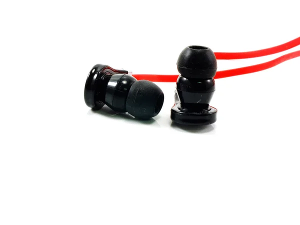 Black and red earphones on white background — Stock Photo, Image