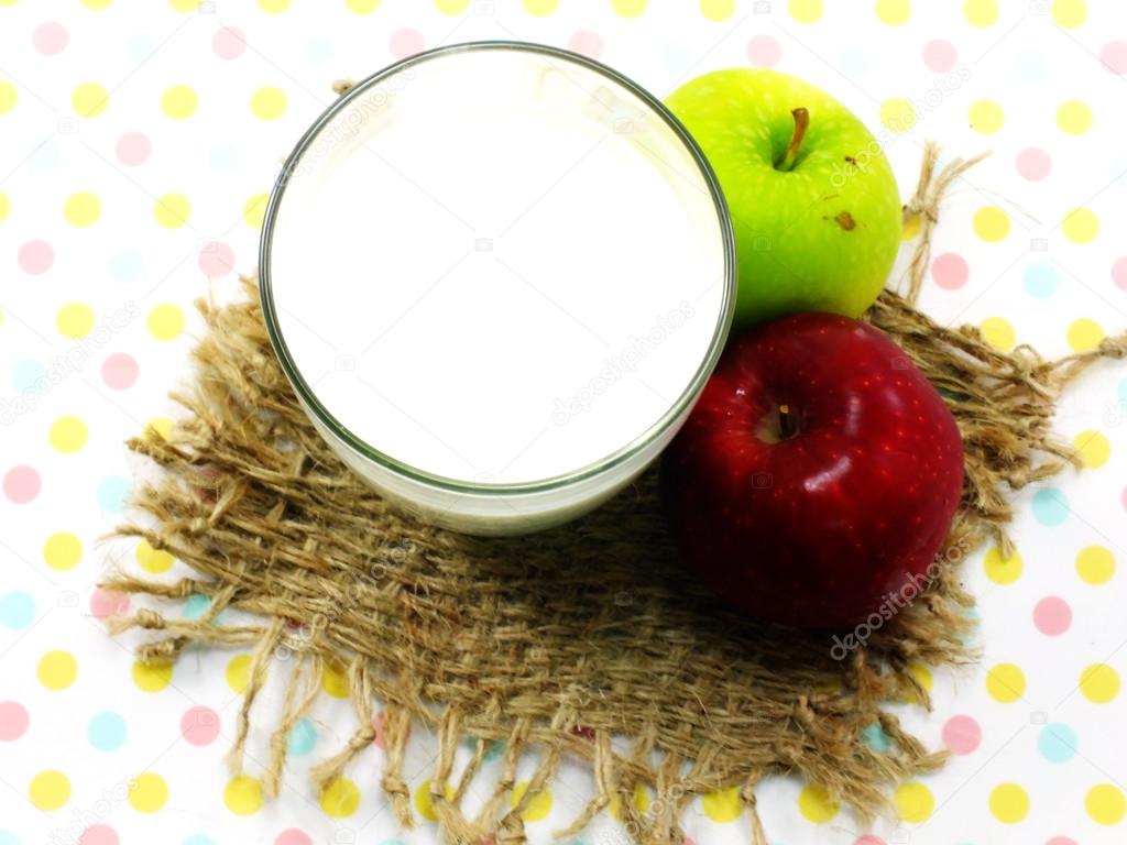 Glass of milk and fresh apple for healthy