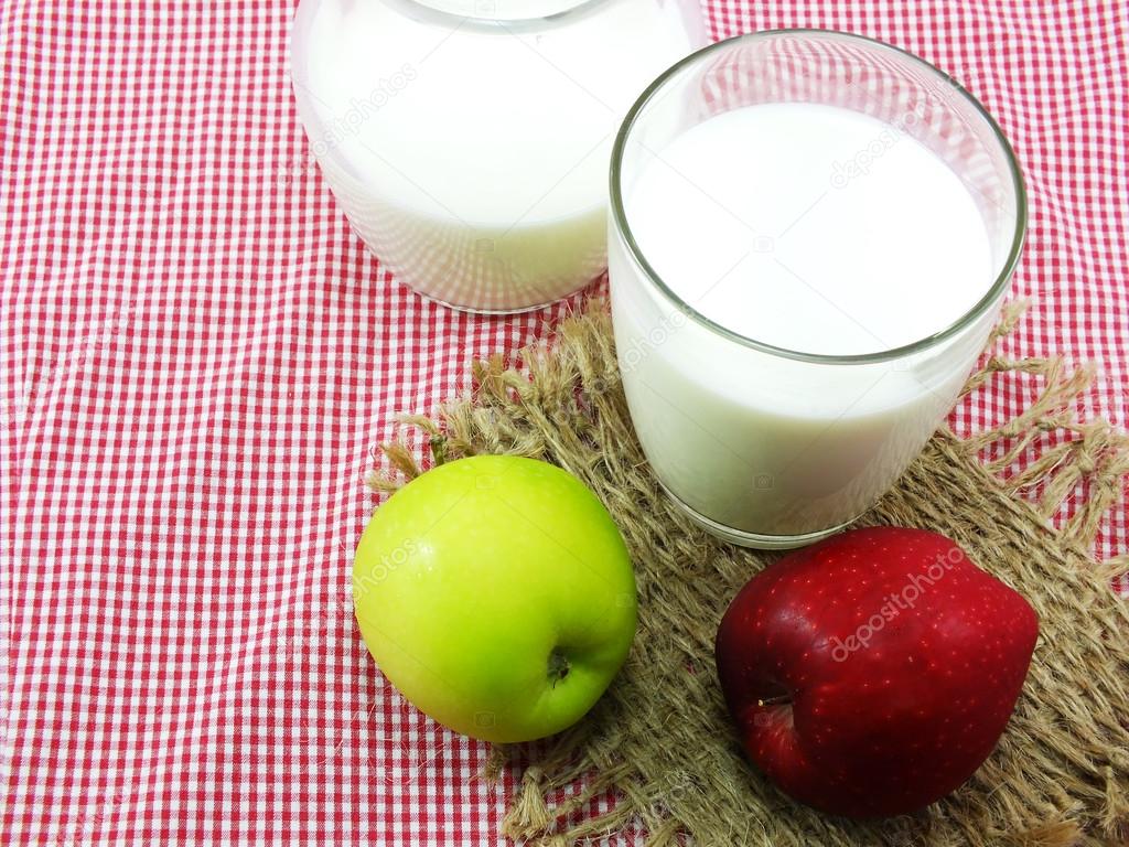 Glass of milk and fresh apple for healthy