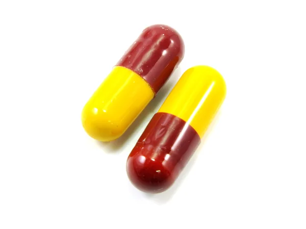 Colored capsules closeup on white background — Stock Photo, Image