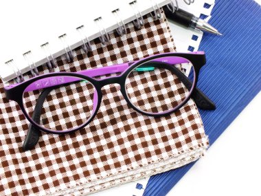 notebooks and glasses close up