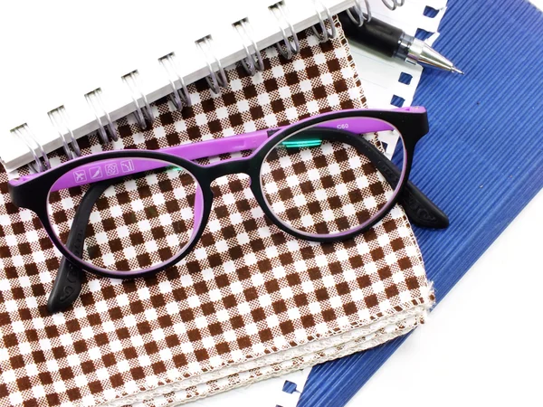 Notebooks and glasses close up — Stock fotografie