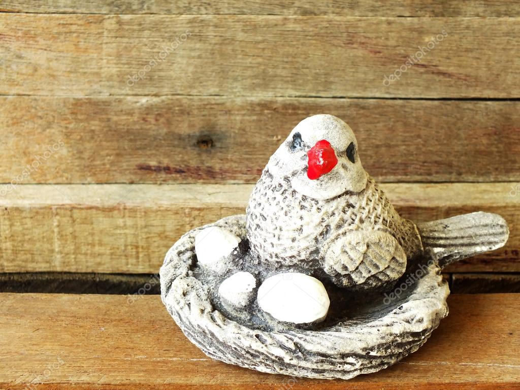 Home Decorations With Ceramic Bird Nest Close Up On Wooden