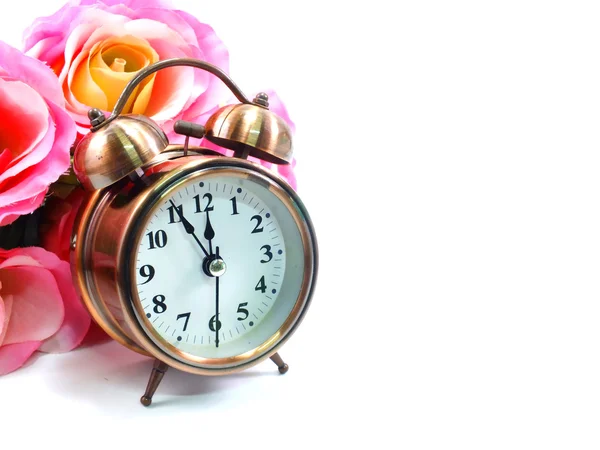Despertador com rosa vintage flor fundo — Fotografia de Stock