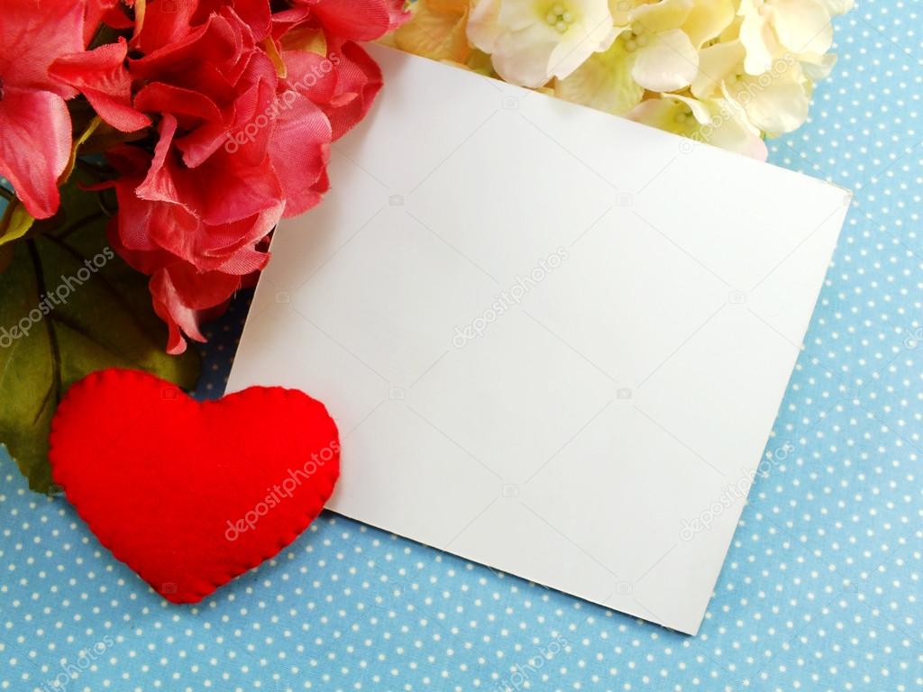 white card and red heart valentines day on blue polka dot background