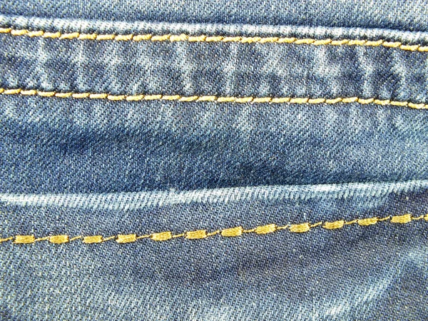 Blå jeans textur med sömmar bakgrund — Stockfoto
