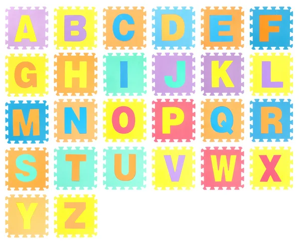 Jigsaw conjunto con alfabeto sobre fondo blanco —  Fotos de Stock