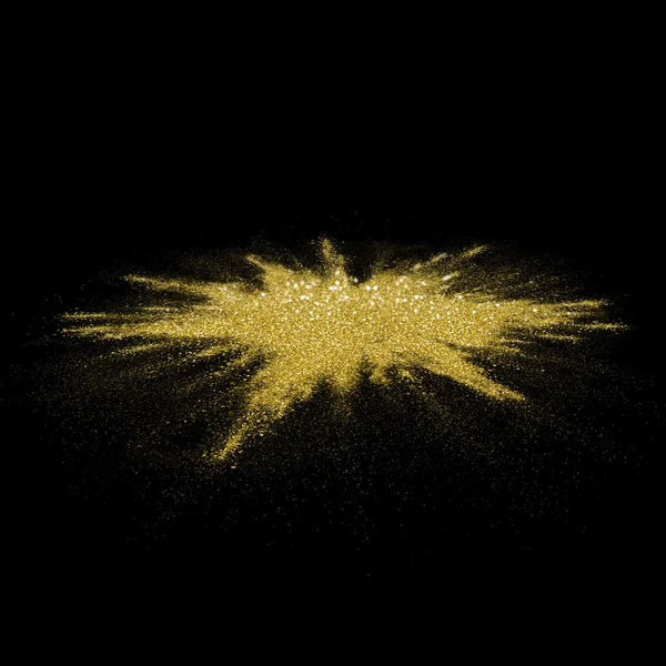 Altın glitter toz siyah arka plan üzerine dağılmış. — Stok fotoğraf