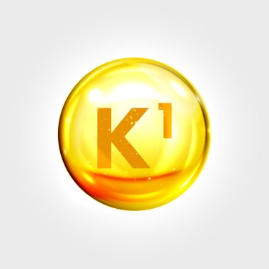 Vitamin K1 altın simgesi. Phylloquinone hap kapsülü