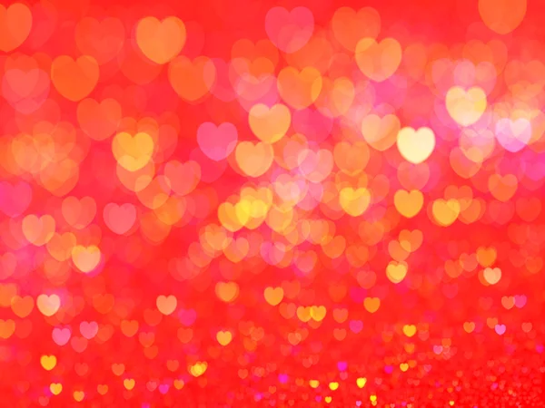 Дефокусований фон з освітленими серцями — стокове фото
