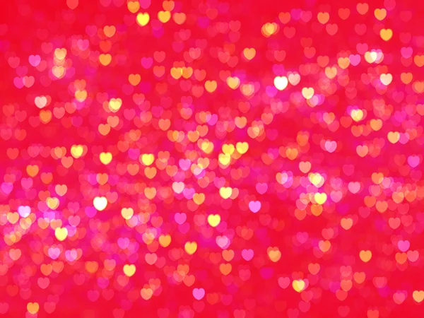 Defocused illuminated hearts background — Stock Photo, Image