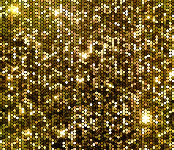 Блестящие блёстки на фоне золота — стоковое фото