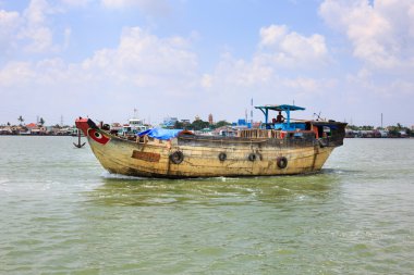 Ho Chi Minh City, Vietnam - June 27, 2015 - a large wooden boat on a river active in Hochiminh City, Vietnam