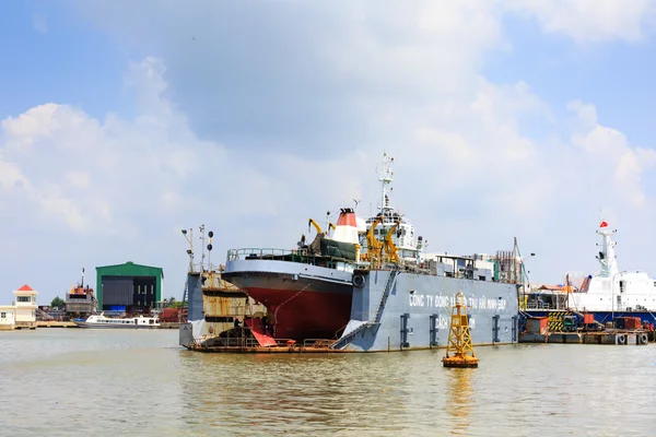 Ho Chi Minh City, Vietnam - June 27, 2015 - a ship repair factory is operating on a river in HoChiMinh City, Vietnam