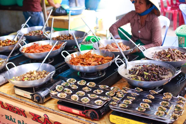 Ho Chi Minh City, Vietnam - June 28, 2015 - a woman who was selling seafood products cooked in market c Gio, HoChiMinh City, Vietnam