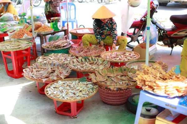 Ho Chi Minh City, Vietnam - June 28, 2015 - a woman who was selling dried seafood products in the market c Gio, HoChiMinh City, Vietnam