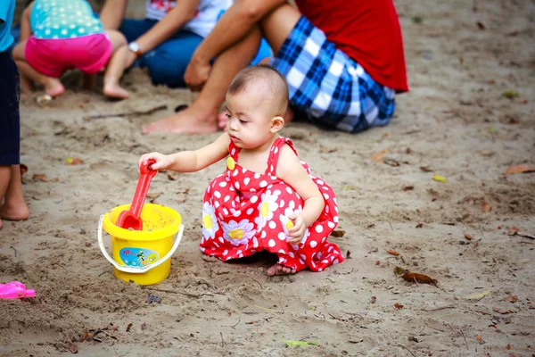 Hochiminh City, Vietnam - June 21, 2015: unidentified, in a park baby girl playing sand alone in Ho Chi Minh City, Vietnam — Stock Photo, Image