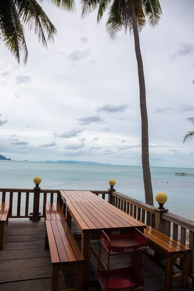 view of the restaurant in front of the beach with light blue sea.