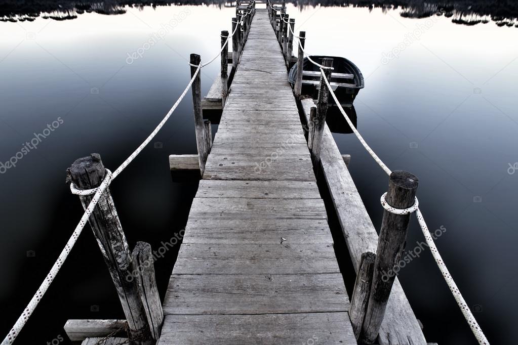 wooden jetty on a quiet lake