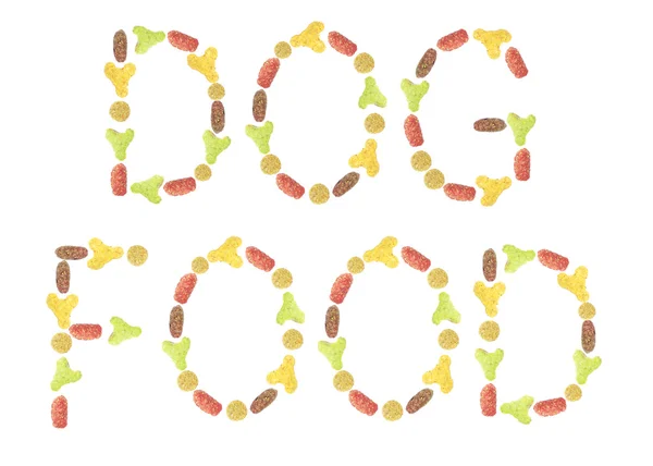 Iscrizione multicolore DOG fatta di cibo per animali domestici secco . — Foto Stock
