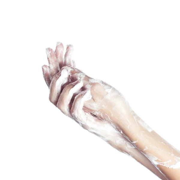 Woman washes her hands. pictured female hands in soapsuds. Isolated on white — Stock Photo, Image