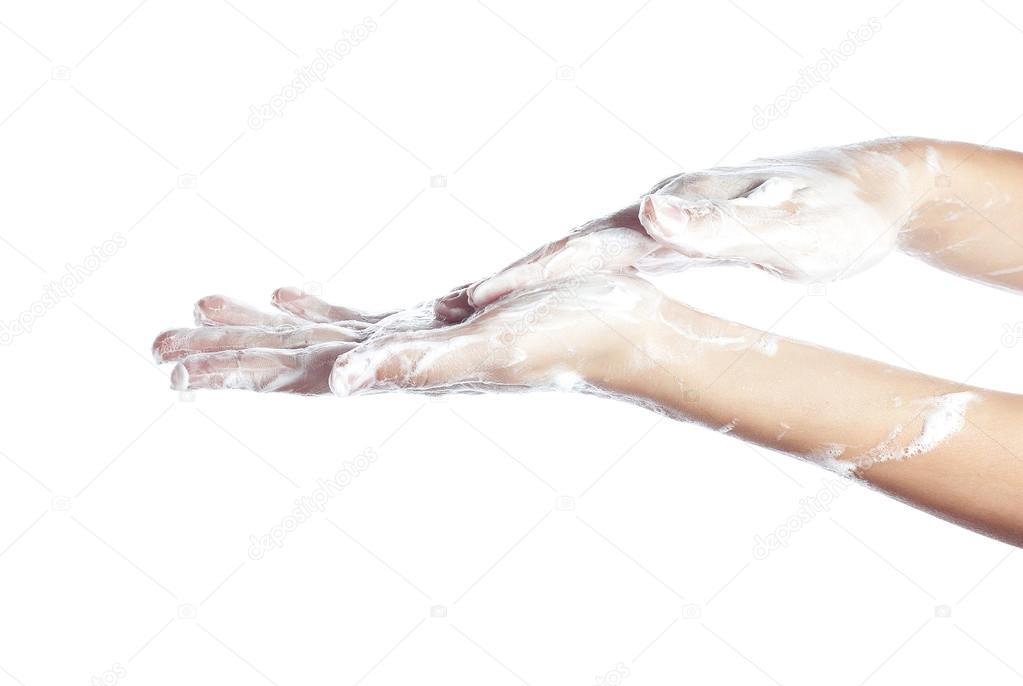 Woman washes her hands. pictured female hands in soapsuds. Isola