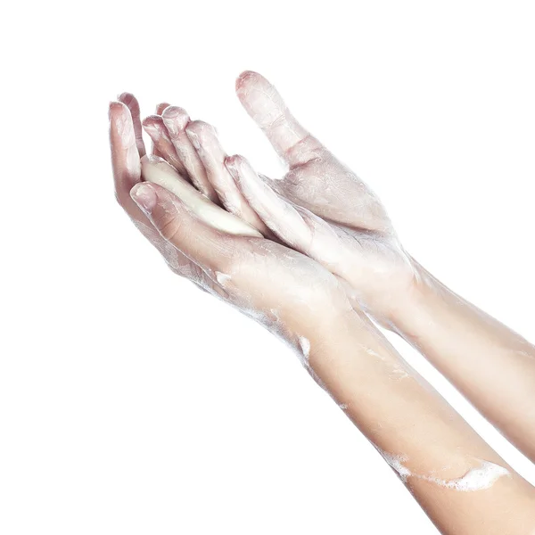 Woman washes her hands. pictured female hands in soapsuds. Isolated on white — Stock Photo, Image