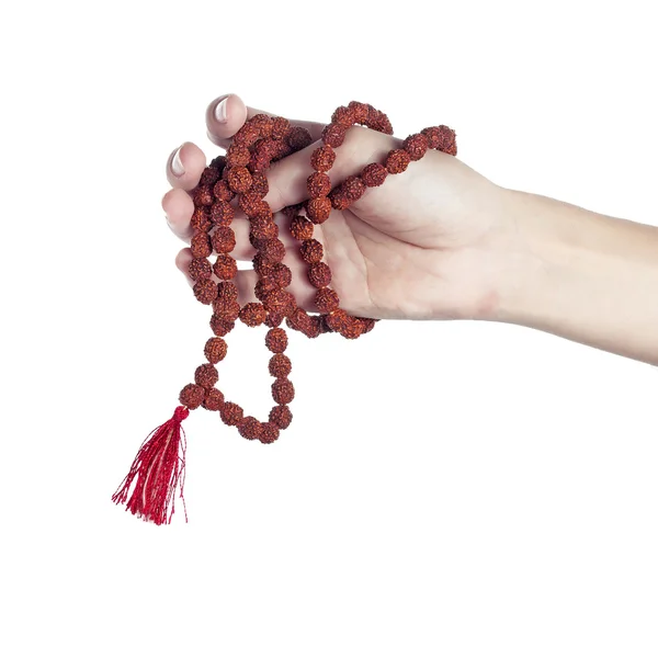 Rudraksha rosary in a female hand. Japa mala — Stock Photo, Image