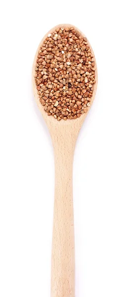 Buckwheat in a spoon on a white background — Stock Photo, Image