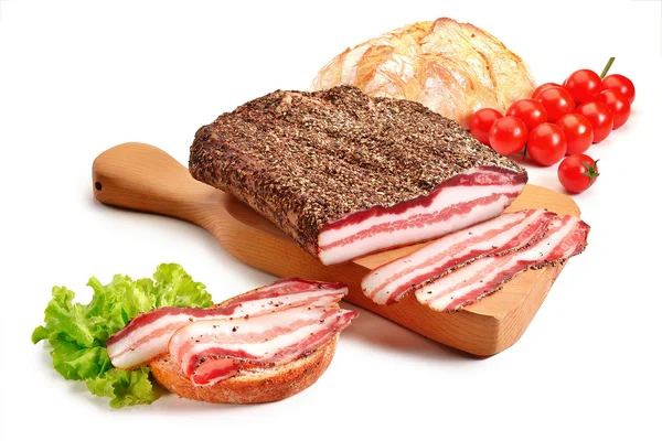 Cutting board with bacon and bread — Stock Photo, Image