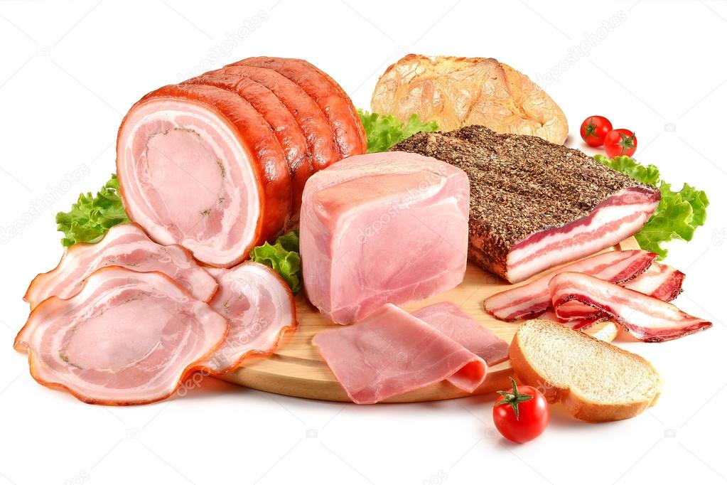 Cutting board with pork, bacon, ham and bread
