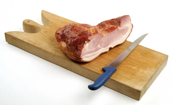 Roasted bacon smoked Tyrolean speck on cutting board — Stock Photo, Image