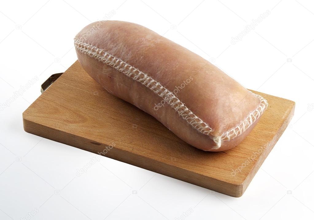 Cotechino Sausage with Rind on cutting board