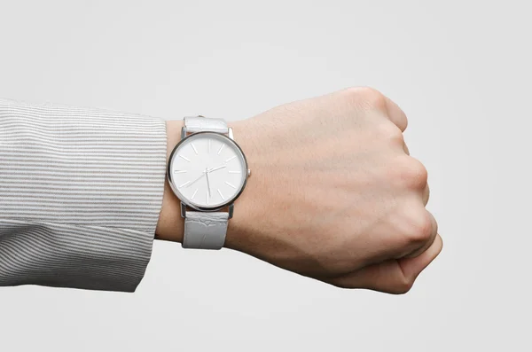 手のビジネスマンにスタイリッシュな白い腕時計 ストック画像